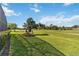 Picturesque view of the golf course and greenery, perfect for outdoor enjoyment and recreation at 2746 Windsorgate Ln, Orlando, FL 32828