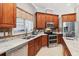 Bright kitchen features modern appliances, granite countertops, and a window over the sink at 2746 Windsorgate Ln, Orlando, FL 32828