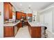 Spacious kitchen featuring stainless steel appliances, granite countertops, and ample cabinet space at 2746 Windsorgate Ln, Orlando, FL 32828