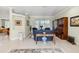 Bright living room featuring tile floors, elegant furnishings, and natural light at 2746 Windsorgate Ln, Orlando, FL 32828