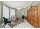 Elegant living room with tile floors, chandelier, and detailed woodwork at 2746 Windsorgate Ln, Orlando, FL 32828
