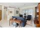 Spacious living room showcasing tile floors, elegant seating, and access to other rooms at 2746 Windsorgate Ln, Orlando, FL 32828