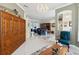 Open-concept living area with tile flooring, classic furnishings, and a decorative china cabinet at 2746 Windsorgate Ln, Orlando, FL 32828