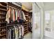 Spacious walk-in closet with rods and shelving for optimal organization and storage of clothes and shoes at 2746 Windsorgate Ln, Orlando, FL 32828