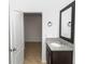 Bathroom featuring granite sink, tile floor and an entrance to another room at 296 Inman Blvd, Winter Haven, FL 33881