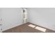 Unfurnished bedroom with carpet and natural light from a single window at 296 Inman Blvd, Winter Haven, FL 33881