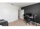 Office with a modern computer setup, desk chair, and dark accent wall at 296 Inman Blvd, Winter Haven, FL 33881
