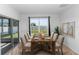 Dining room featuring a wooden table with seating for eight and sliding glass door to backyard at 296 Inman Blvd, Winter Haven, FL 33881