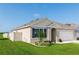 Charming single-story home with a well-manicured lawn, attached garage, and tasteful landscaping at 296 Inman Blvd, Winter Haven, FL 33881