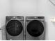 Functional laundry room with modern Samsung washer and dryer units at 296 Inman Blvd, Winter Haven, FL 33881