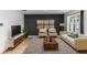 Comfortable living room featuring modern furniture, stylish rug, and a sleek media console at 296 Inman Blvd, Winter Haven, FL 33881