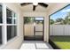Screened in porch with ceiling fan that looks out onto the backyard at 296 Inman Blvd, Winter Haven, FL 33881