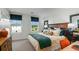 Stylishly decorated bedroom with plush bedding, designer accents, and ample natural light at 3060 Skyline Loop, Kissimmee, FL 34758