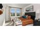 Well-lit bedroom with modern decor, soft lighting, and large windows providing a relaxing space at 3060 Skyline Loop, Kissimmee, FL 34758