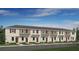 New townhome construction showing simple landscaping and neat front lawns with consistent neutral color scheme at 3060 Skyline Loop, Kissimmee, FL 34758