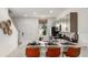 Modern kitchen features quartz countertops, stainless steel appliances, and a cozy breakfast bar at 3060 Skyline Loop, Kissimmee, FL 34758