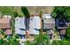 Aerial view of property showcasing home's layout, landscaping, and proximity to other homes at 3065 Bridgehampton Ln, Orlando, FL 32812