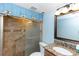 Bright bathroom with a tiled walk-in shower, granite counters and fixtures at 3065 Bridgehampton Ln, Orlando, FL 32812