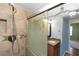 Bathroom with a tile shower and a granite sink at 3065 Bridgehampton Ln, Orlando, FL 32812