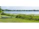 Picturesque lakeside view with a boat, showcasing the tranquil and natural surroundings at 3065 Bridgehampton Ln, Orlando, FL 32812