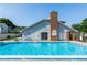 Community pool with diving board and pool house at 3065 Bridgehampton Ln, Orlando, FL 32812