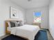 Comfortable bedroom with a queen-sized bed and stylish decor, bathed in natural light at 3335 Azolla St, Orlando, FL 32808