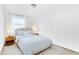 Bright bedroom featuring hardwood floors, a plush rug, and abundant natural light at 3335 Azolla St, Orlando, FL 32808