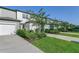 Attractive townhome with lush landscaping, a private driveway, and attached garage at 3335 Azolla St, Orlando, FL 32808