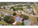 Aerial view of a home with mature trees and RV camping nearby at 339 Holborn Loop, Davenport, FL 33897