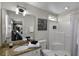 Well-lit bathroom with granite countertops and a tiled shower with toiletries at 339 Holborn Loop, Davenport, FL 33897