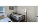 Cozy shared bedroom furnished with two comfortable twin beds, decor pillows and a lamp at 339 Holborn Loop, Davenport, FL 33897