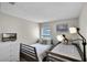 Shared bedroom offering two comfortable twin beds, a window for natural light, and a dresser with a television at 339 Holborn Loop, Davenport, FL 33897