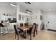 The dining room features modern lighting, wood flooring, and neutral walls at 339 Holborn Loop, Davenport, FL 33897