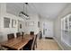 The dining room features modern lighting, wood flooring, and neutral walls at 339 Holborn Loop, Davenport, FL 33897