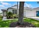 Charming single-story home with a well-manicured lawn and a two car garage at 339 Holborn Loop, Davenport, FL 33897