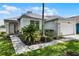 Charming single-story home with well-manicured lawn and two car garage at 339 Holborn Loop, Davenport, FL 33897