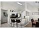 Bright kitchen featuring granite countertops, modern appliances, and a breakfast bar with seating at 339 Holborn Loop, Davenport, FL 33897
