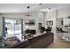 The living room features a sliding glass door and a backyard pool at 339 Holborn Loop, Davenport, FL 33897