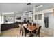 Open concept living space with dining and living room with natural light at 339 Holborn Loop, Davenport, FL 33897