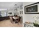 Open concept living space with dining and living room with natural light at 339 Holborn Loop, Davenport, FL 33897
