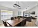 Open concept living space with dining and living room filled with natural light at 339 Holborn Loop, Davenport, FL 33897