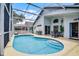 Inviting screened-in pool area with ample seating perfect for relaxation and entertainment at 339 Holborn Loop, Davenport, FL 33897