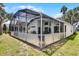 Pool patio featuring an outdoor lounge area, a grill, and backyard at 339 Holborn Loop, Davenport, FL 33897