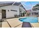 Pool patio with a large pool, covered outdoor space, and access to the home at 339 Holborn Loop, Davenport, FL 33897
