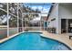 Screened-in pool area featuring a large pool and covered outdoor space at 339 Holborn Loop, Davenport, FL 33897