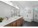 Modern bathroom with double vanity, soaking tub, walk-in shower, and stylish tile work at 3650 Grant Blvd, Orlando, FL 32804