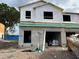 Unfinished exterior of a two-story townhome, showing the initial construction phase with exposed materials at 4244 Campsite Loop, Orlando, FL 32824