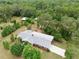 Aerial view of the rear of the home showcasing the new roof, lot size, mature trees, and landscaping at 4802 Anton Ave, Apopka, FL 32712