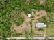 Aerial view of the property showcasing the home's location, lush surroundings, and lot size, perfect for privacy at 4802 Anton Ave, Apopka, FL 32712