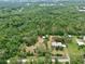 Vast wooded property featuring the main house and multiple additional storage buildings on the lot at 4802 Anton Ave, Apopka, FL 32712